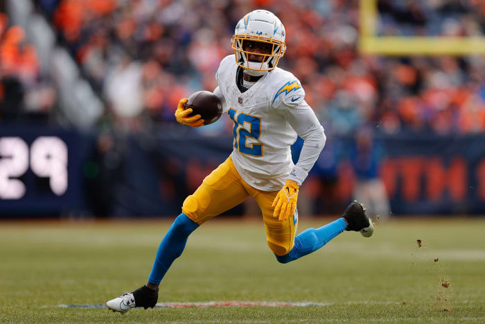 Dec 31, 2023; Denver, Colorado, USA; Los Angeles Chargers wide receiver Derius Davis (12) runs the ball in the second quarter against the Denver Broncos at Empower Field at Mile High. Mandatory Credit: Isaiah J. Downing-USA TODAY Sports